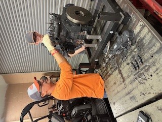 Student working on a Kubota engine