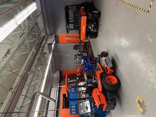 Shop containing different Kubota tractors