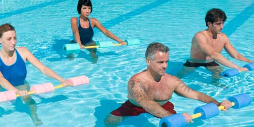 Individuals exercising in a swimming pool