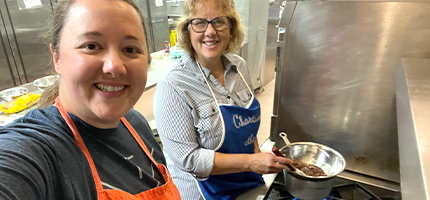 Student and instructing in the kitchen