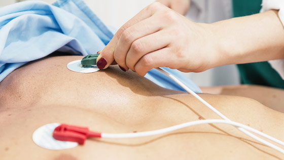 EKG posts being placed on patient